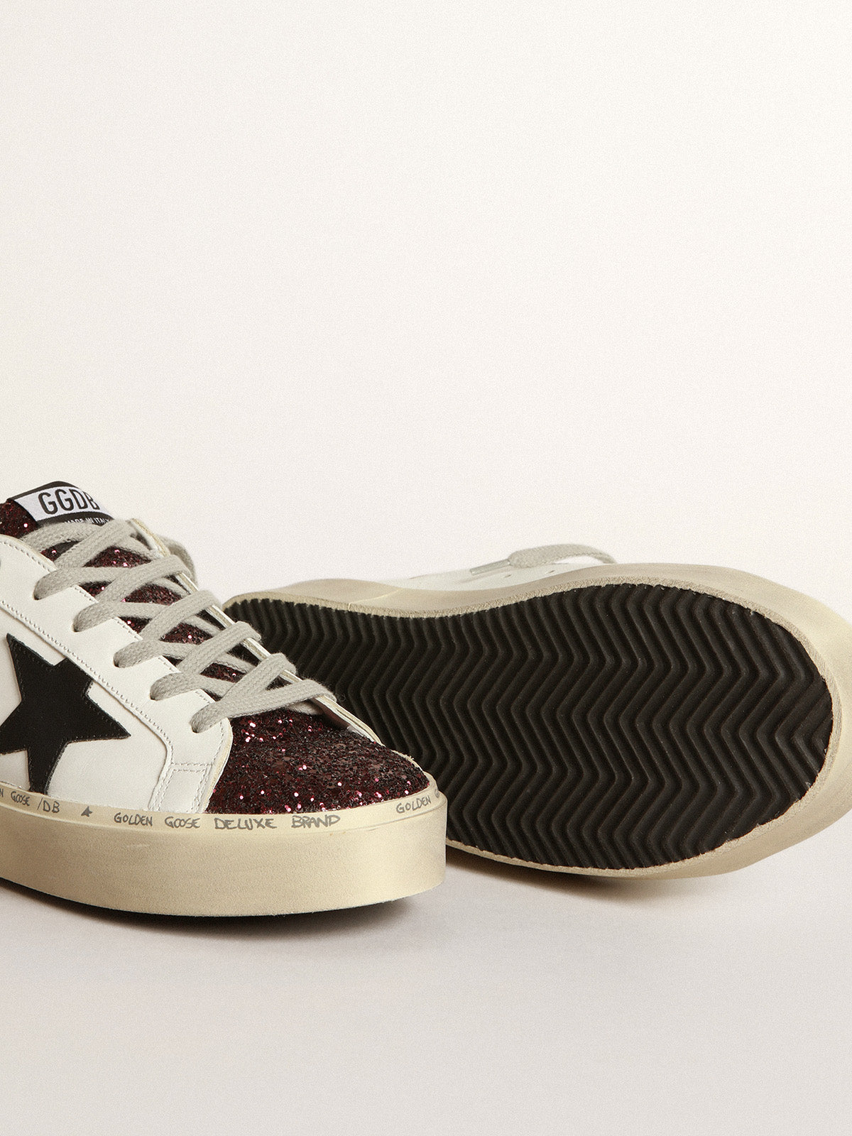 White Hi-Star sneakers with glittery insert and black star| Golden Goose