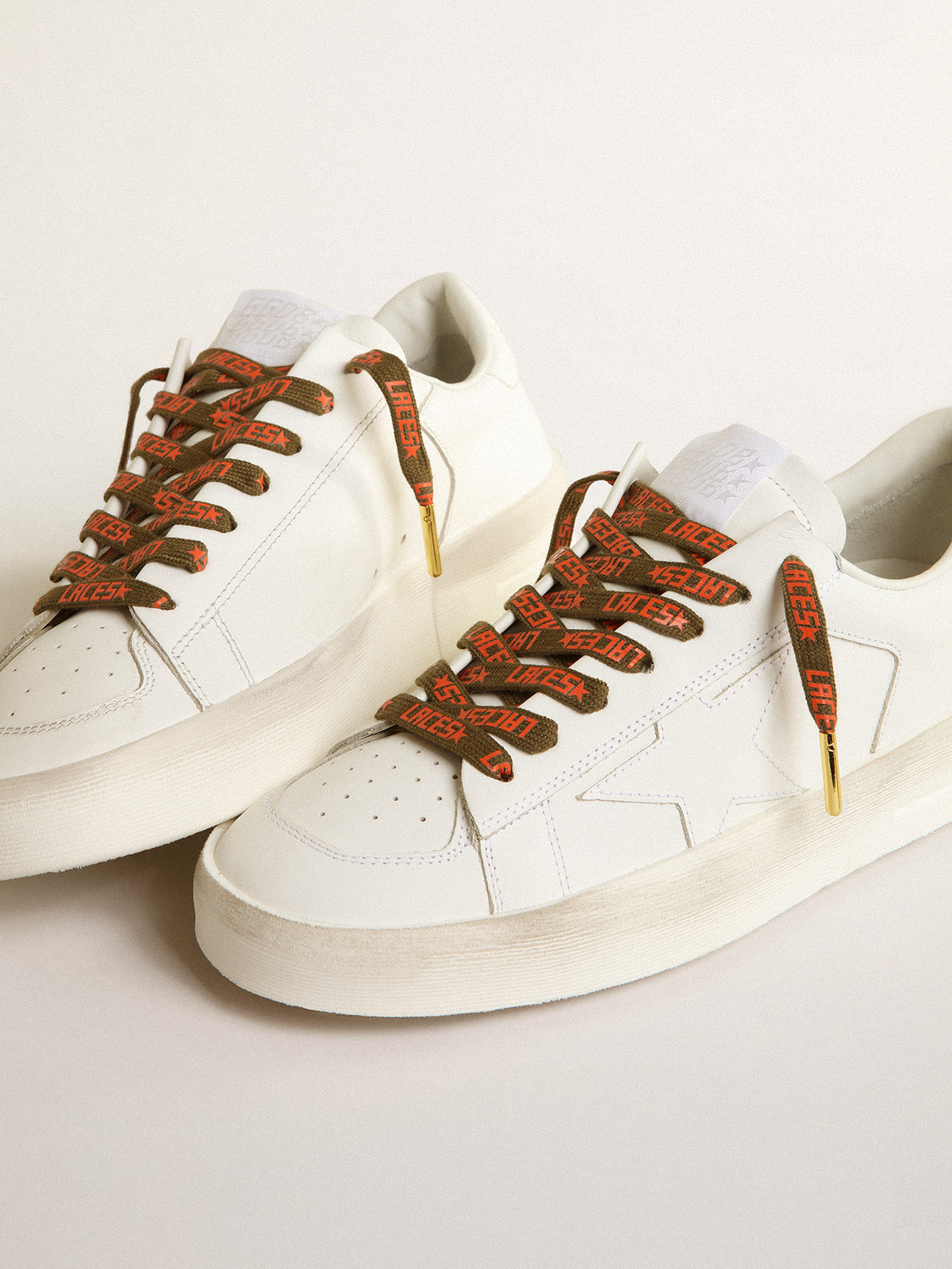 Military-green laces with contrasting orange 'Laces' lettering| Golden Goose