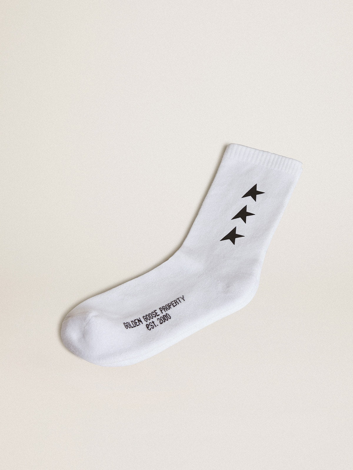 Worn white socks with contrasting black stars| Golden Goose