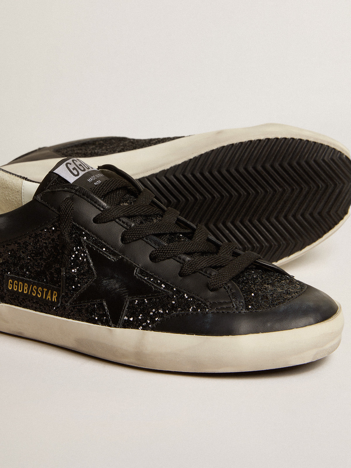 Super-Star in black nappa and glitter with glossy black leather star| Golden Goose