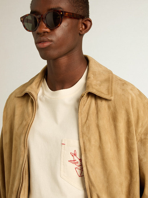 Beige-colored leather jacket with zip fastening