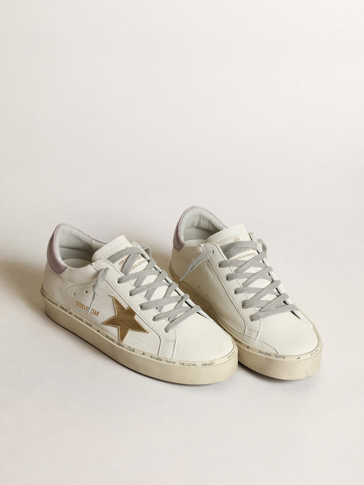 White Hi Star with a gold star and lilac naplak heel tab| Golden Goose