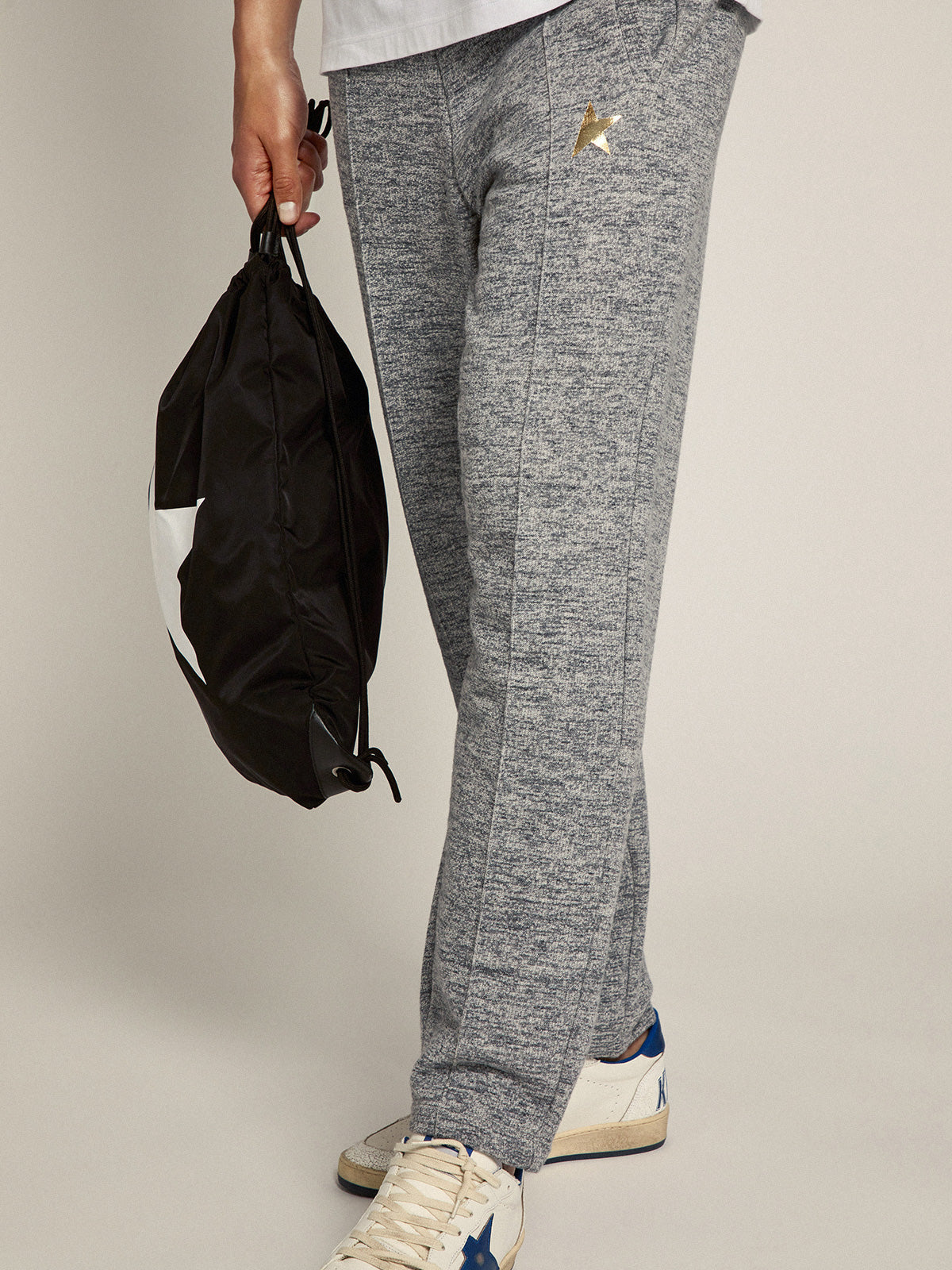 Men's gray joggers with gold star on the front| Golden Goose