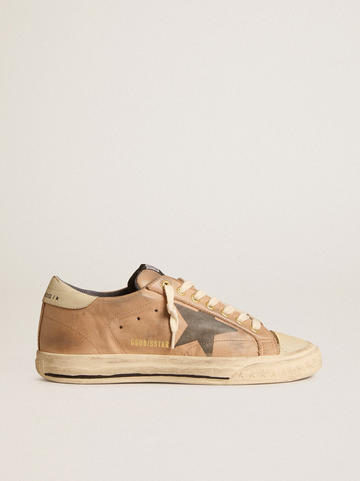Super-Star in beige nubuck with black printed star and leather heel tab| Golden Goose