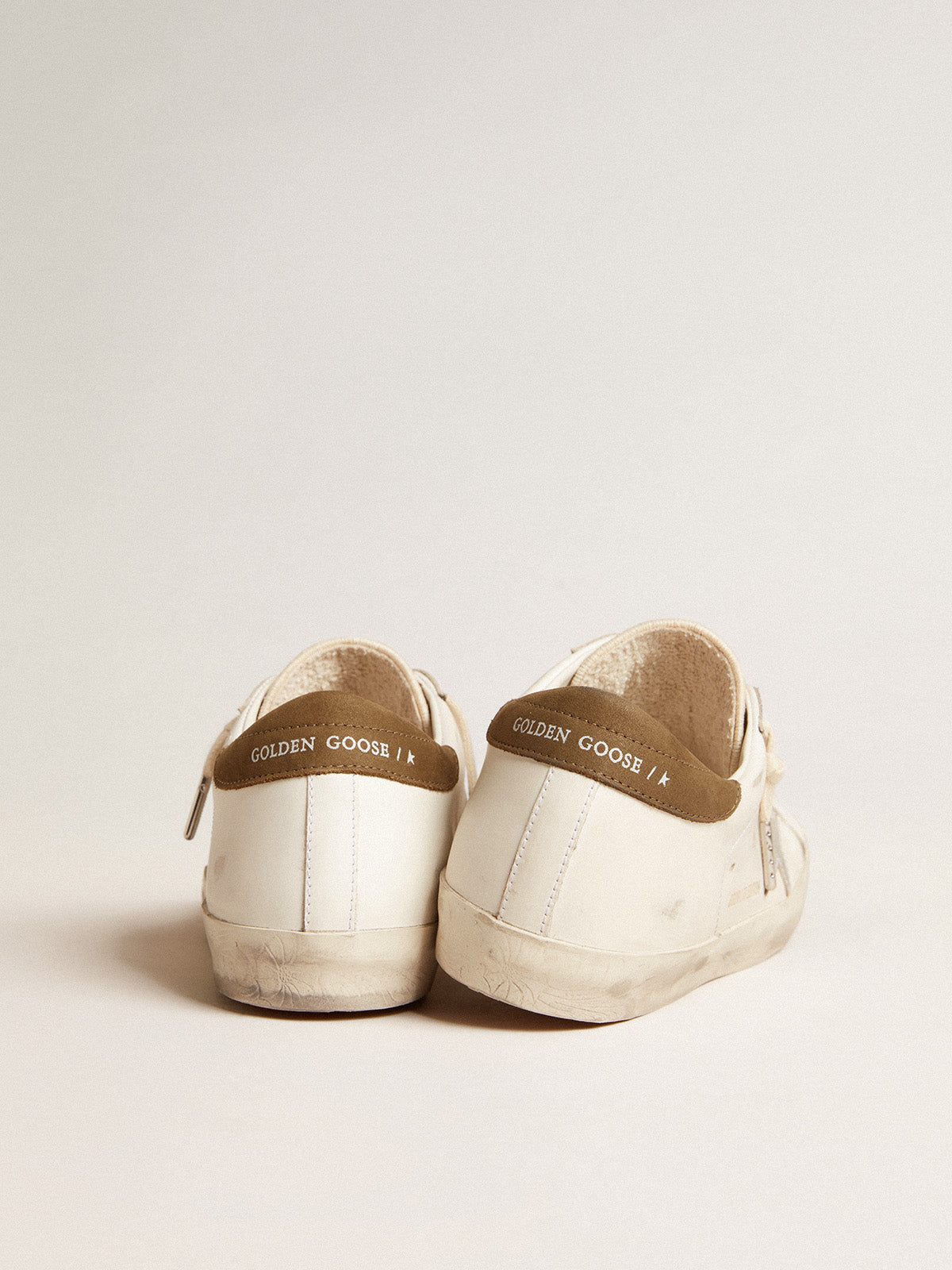 Super-Star LTD with metallic silver leather star and brown heel tab| Golden Goose