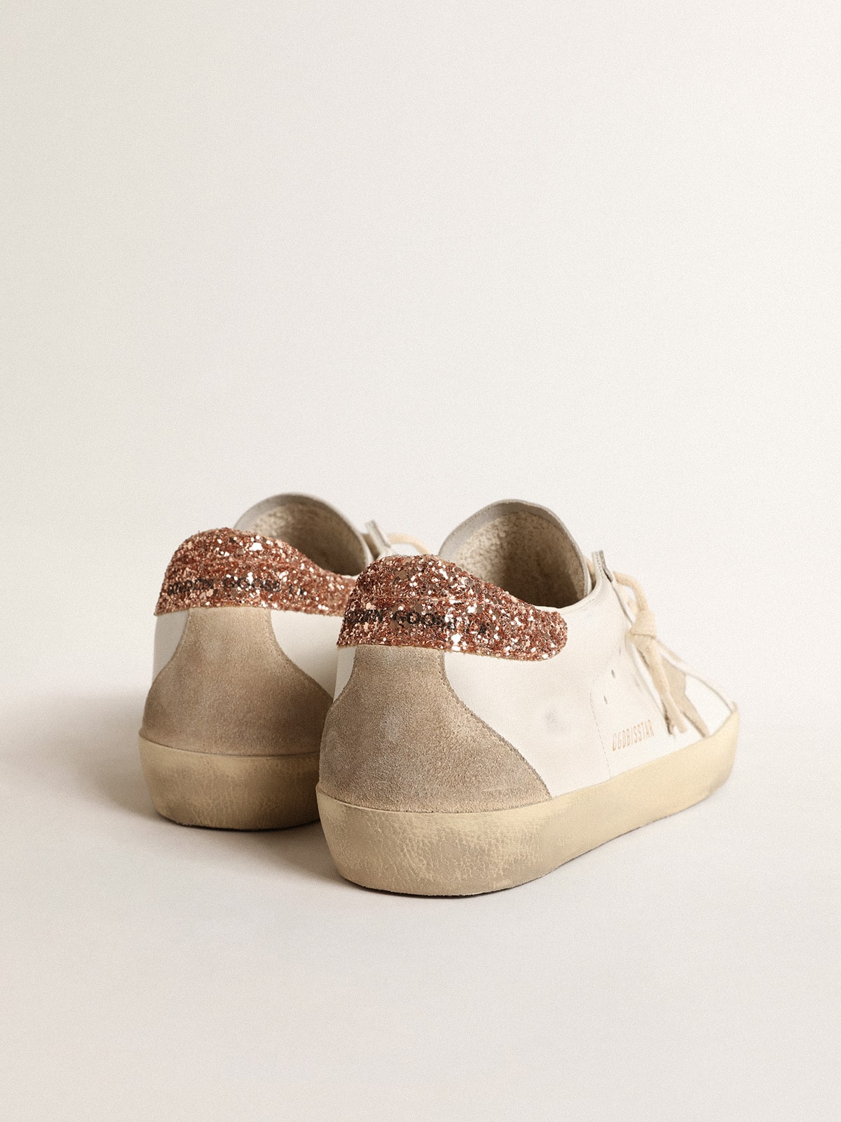 Women's Super-Star with a suede star and peach-pink glitter heel tab| Golden Goose