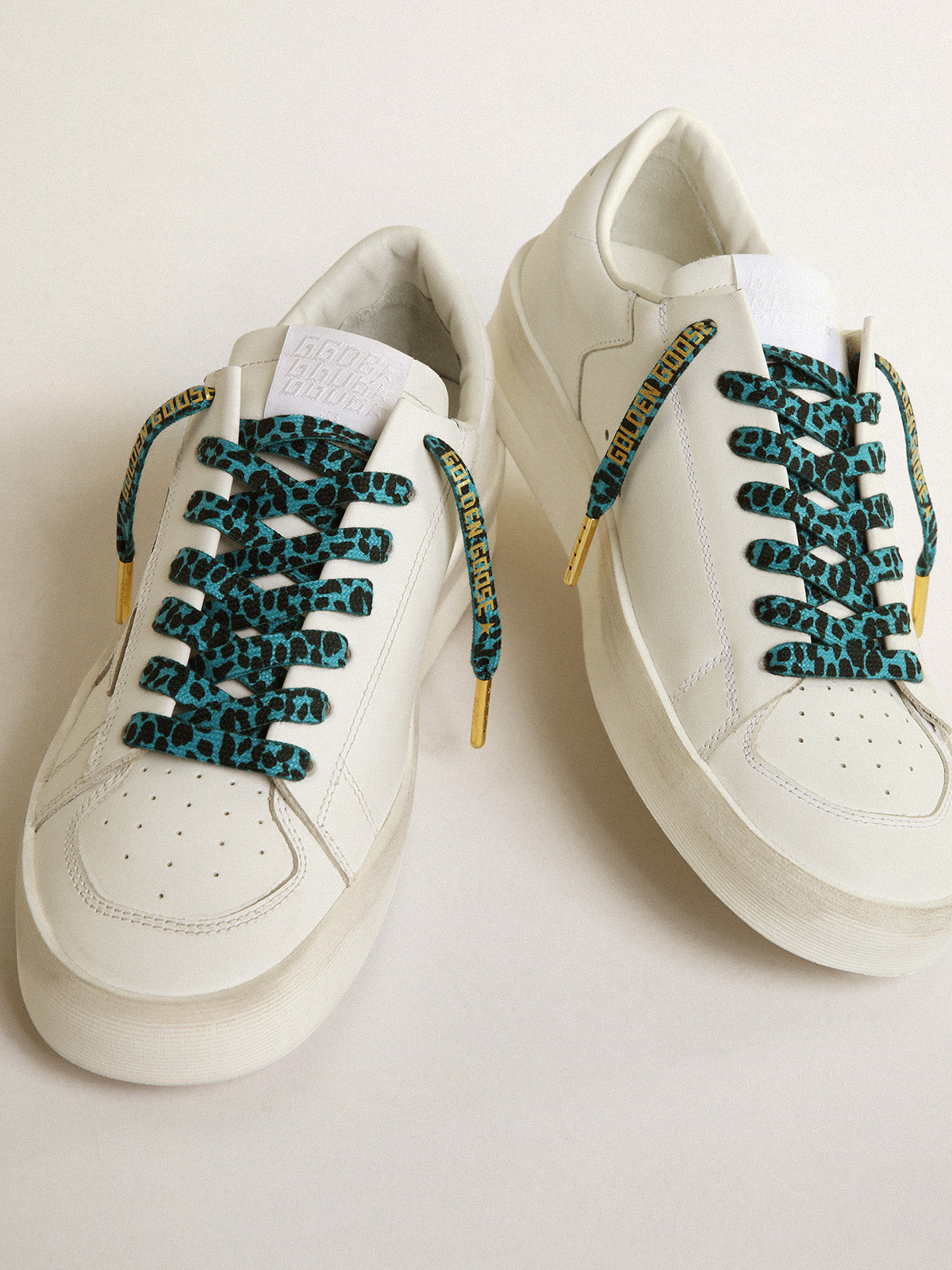 Light blue and black animal-print laces with contrasting gold-colored logo| Golden Goose