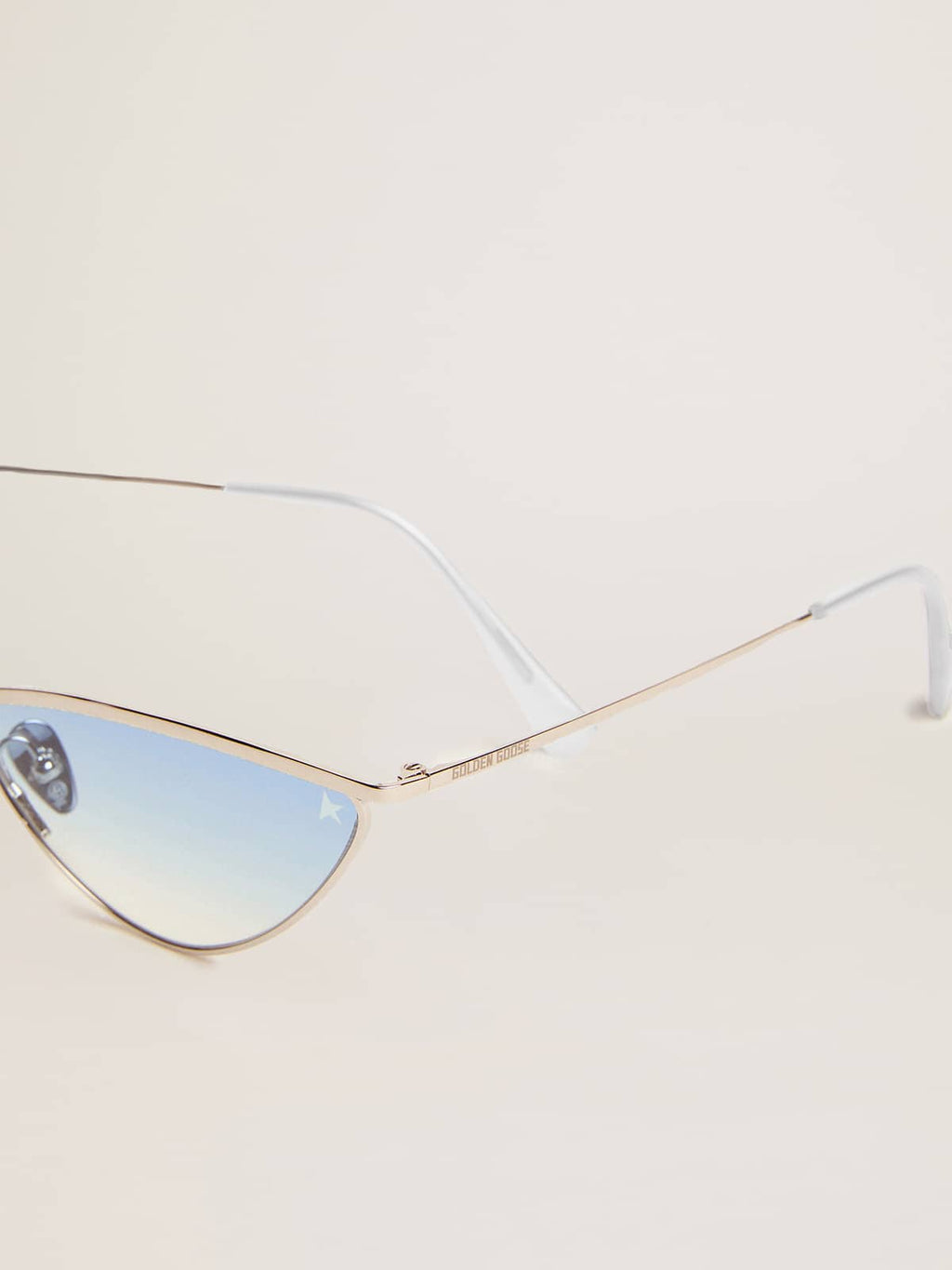 Sunglasses cat-eye style with silver frame and blue lenses| Golden Goose