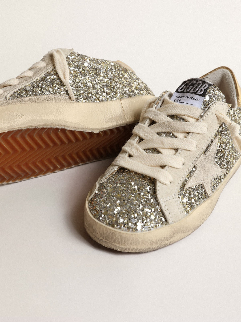 Super-Star Junior in glitter with a suede star and gold heel tab| Golden Goose