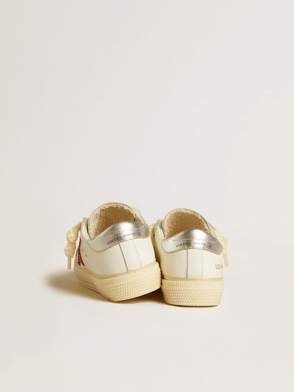May Young with fuchsia glitter star and metallic leather heel tab| Golden Goose