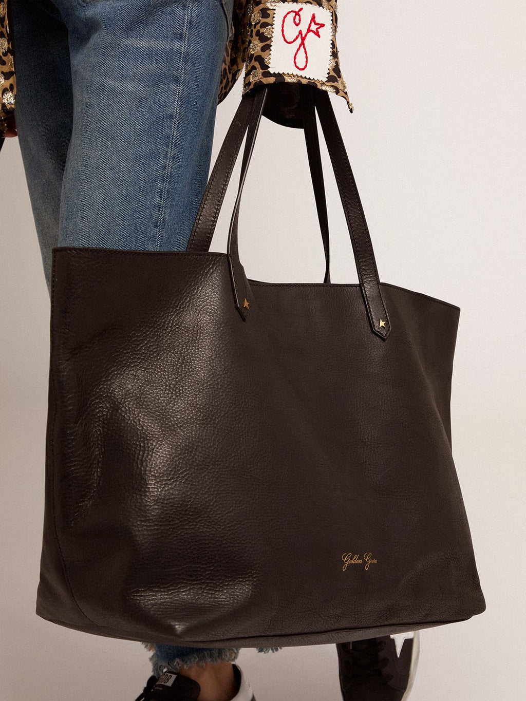 Pasadena Bag in black hammered leather with gold logo on the front| Golden Goose