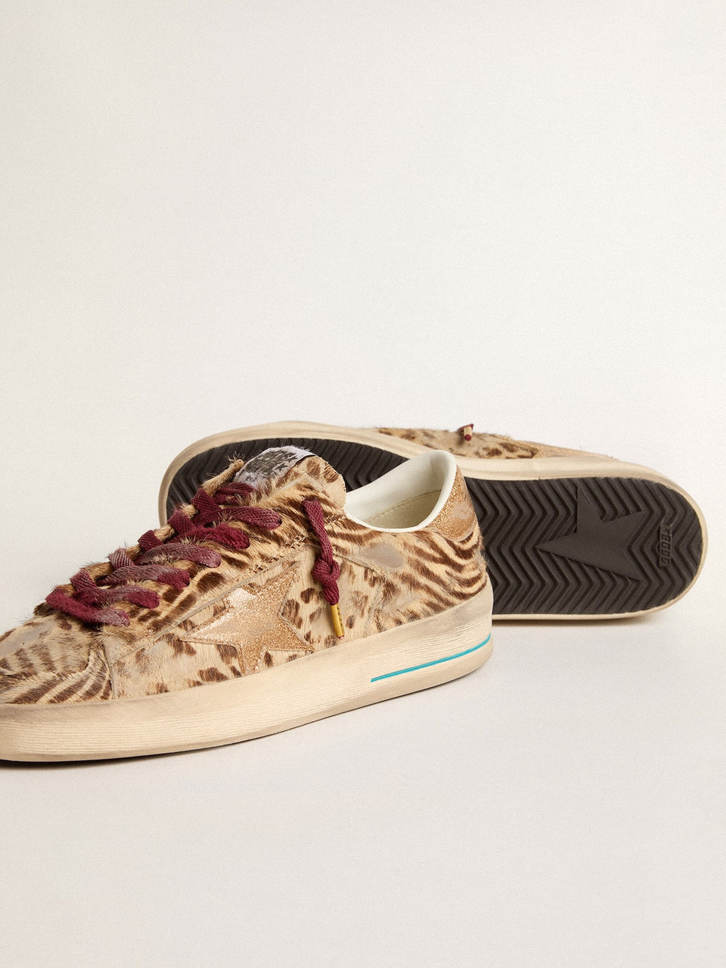 Women's Stardan LTD in animal-print pony skin with gold glitter star| Golden Goose