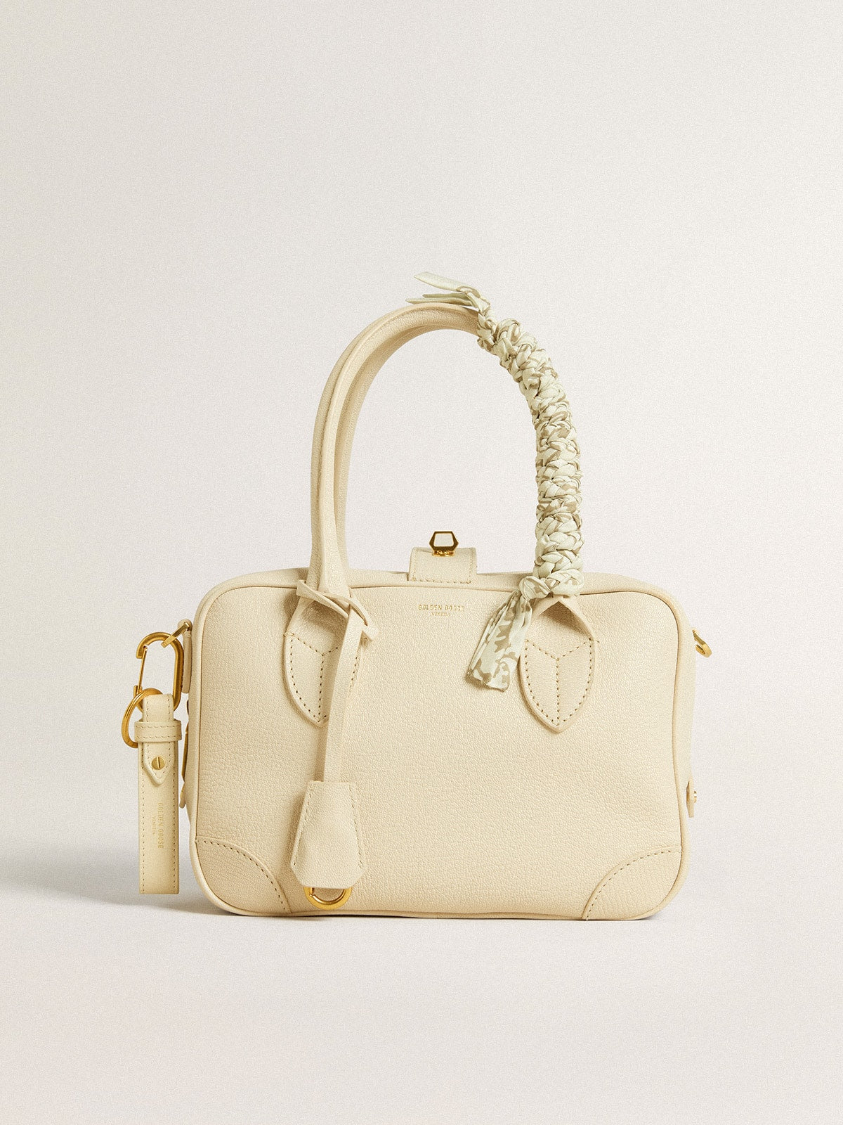 Butter-colored braided fabric charm with brass chain| Golden Goose