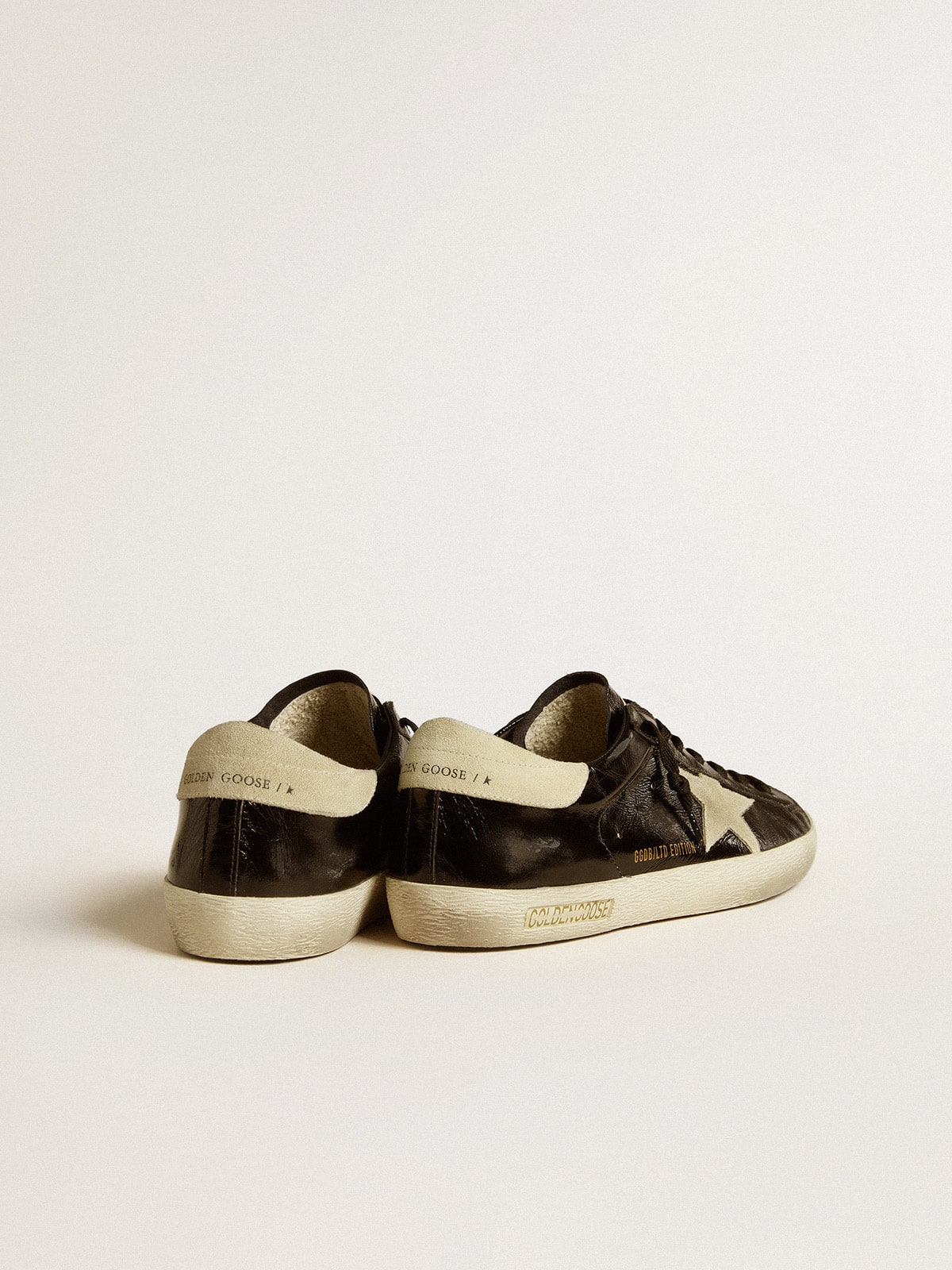 Men's Super-Star LTD in black patent leather with suede star and heel tab| Golden Goose