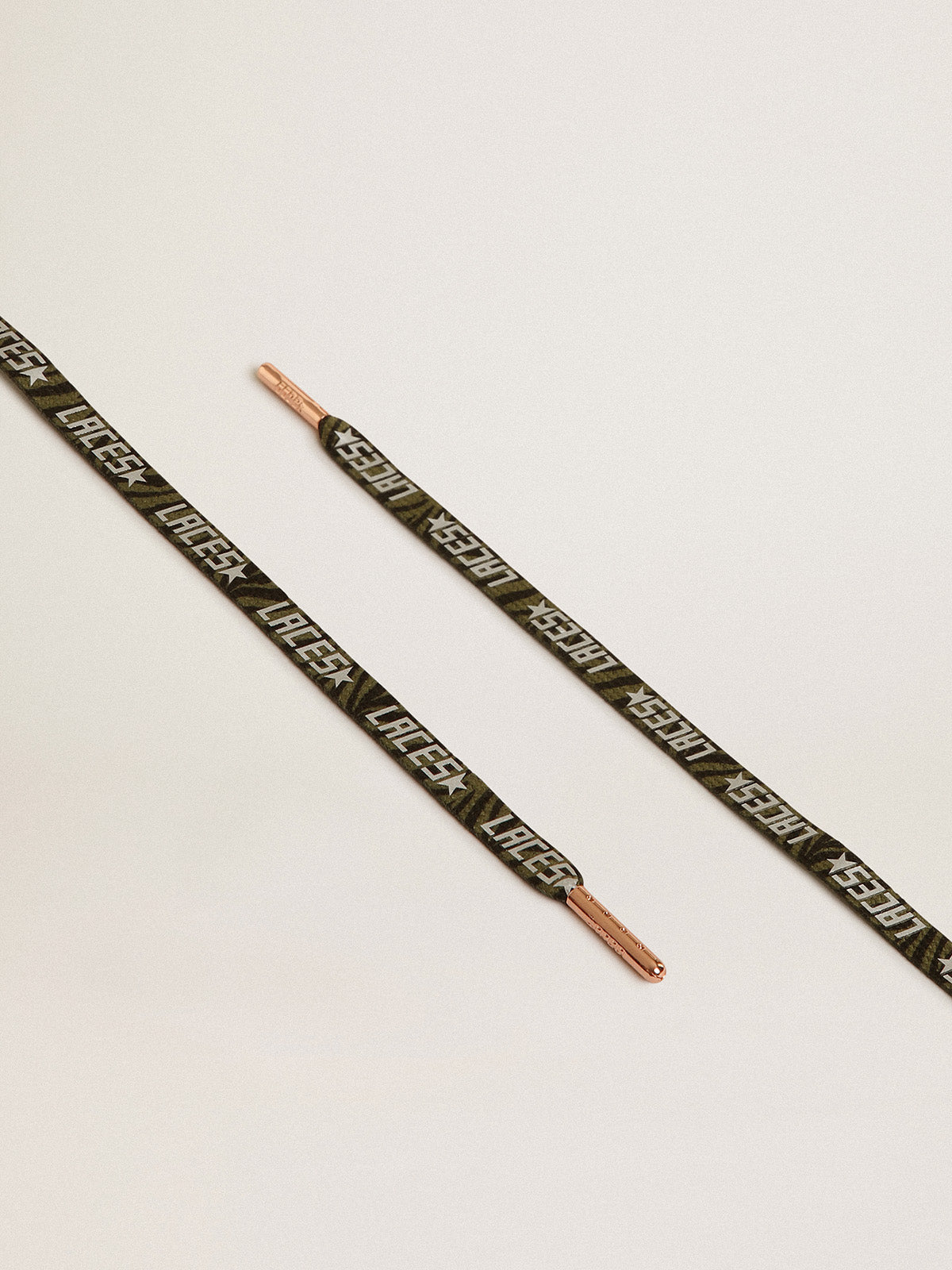 Green and black zebra-print laces with contrasting silver-colored 'Laces' lettering| Golden Goose
