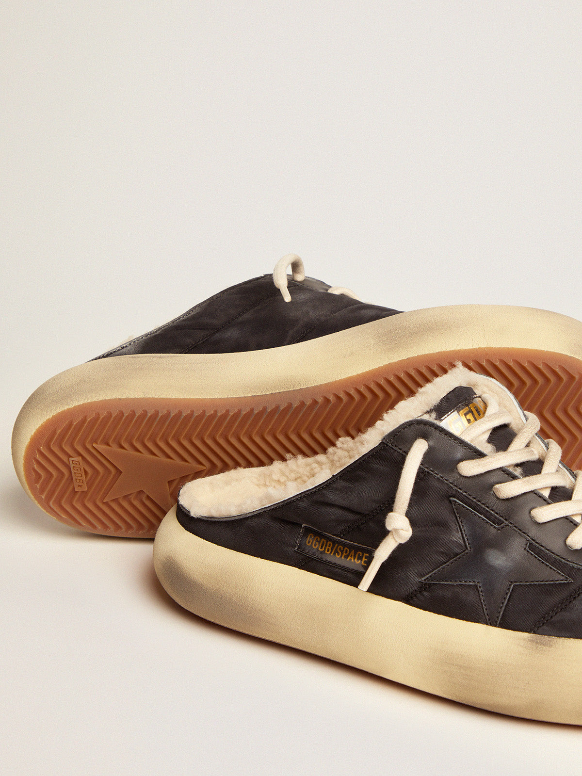 Men's Space-Star Sabot shoes in quilted black nylon with shearling lining| Golden Goose