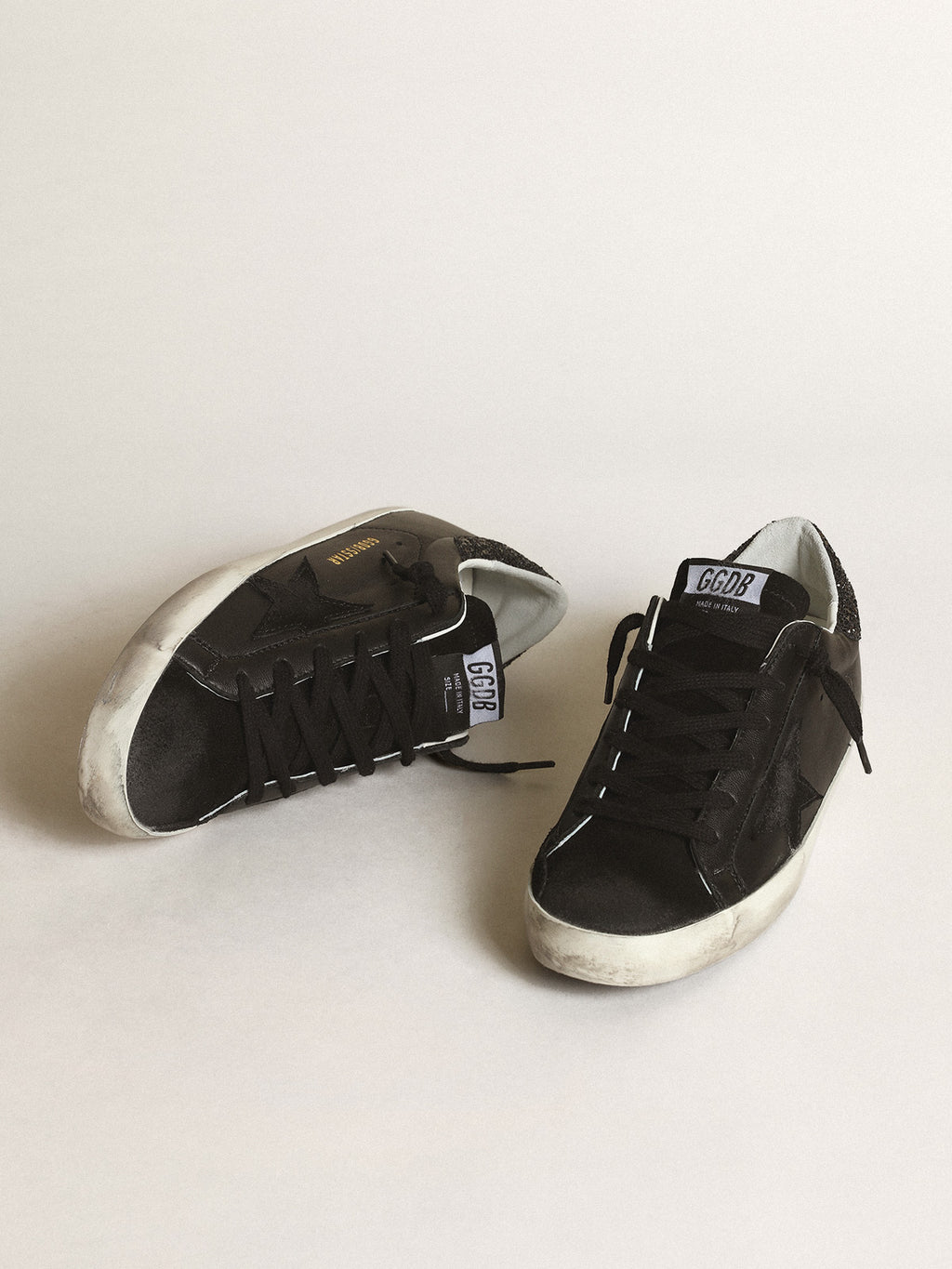 Super-Star in black nappa with black star and glitter heel tab| Golden Goose
