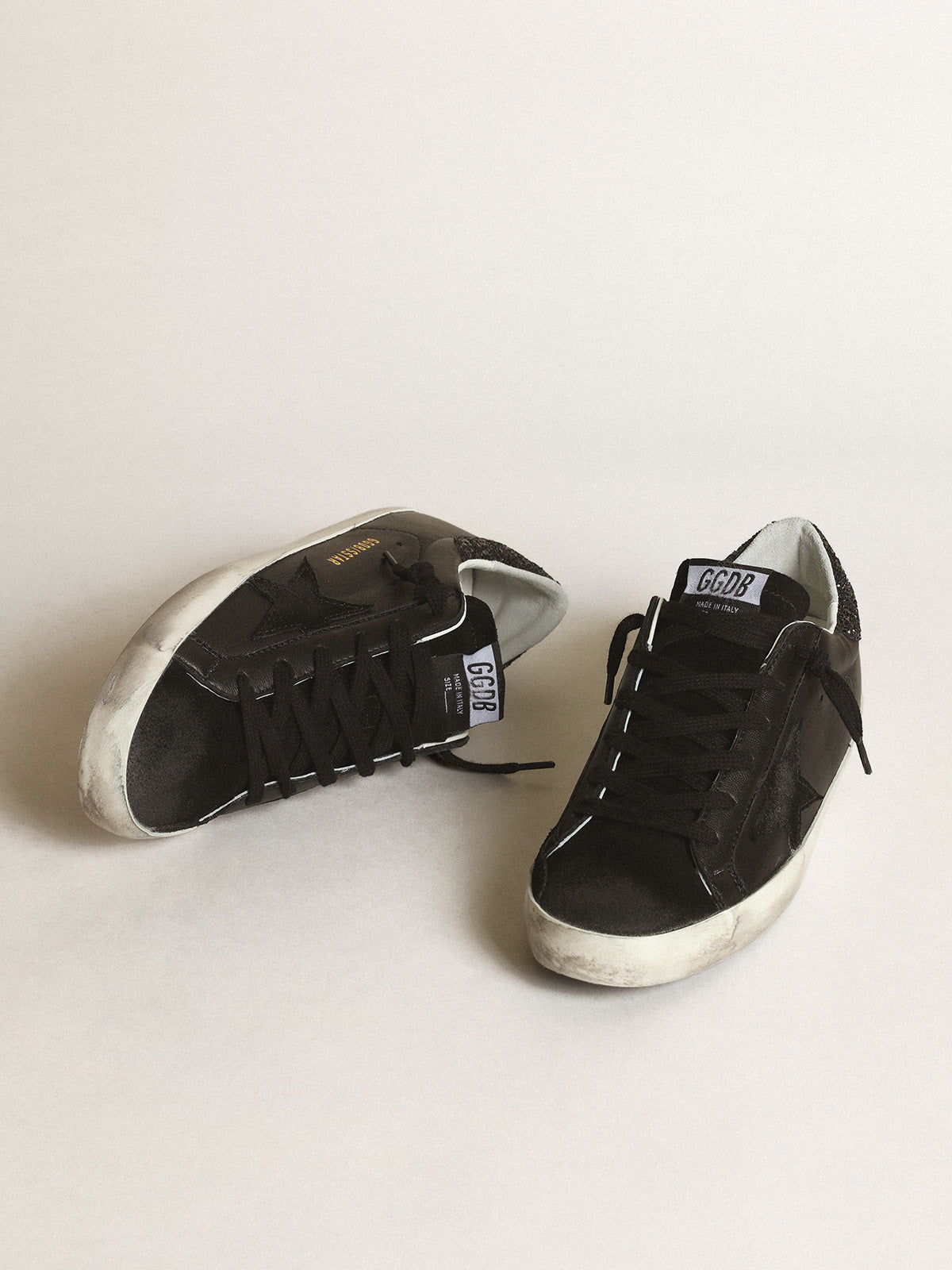 Super-Star in black nappa with black star and glitter heel tab| Golden Goose