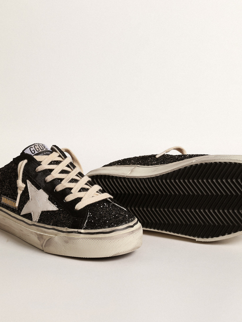 Super-Star Sabots in black glitter with white bio-based star| Golden Goose