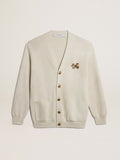 Cardigan in aged white cotton with gold button fastening