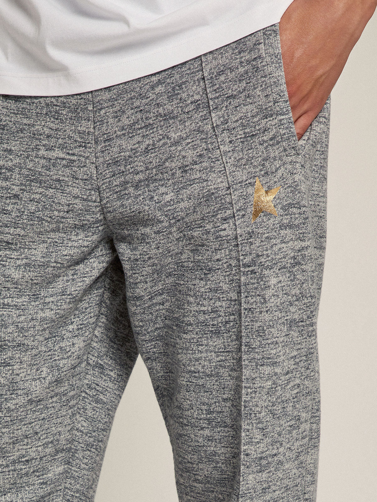 Men's gray joggers with gold star on the front| Golden Goose