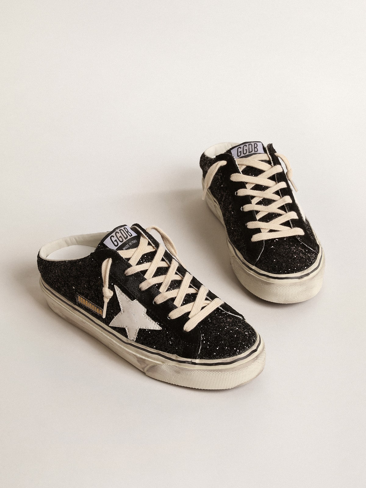 Super-Star Sabots in black glitter with white bio-based star| Golden Goose