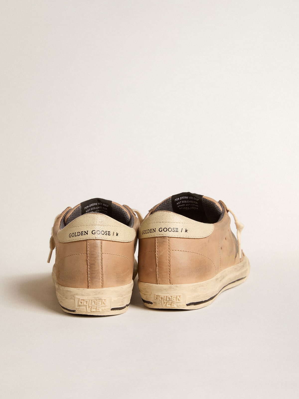 Super-Star in beige nubuck with black printed star and leather heel tab| Golden Goose