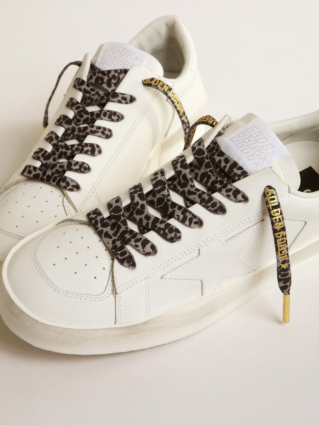 Gray and black animal-print laces with contrasting gold logo| Golden Goose