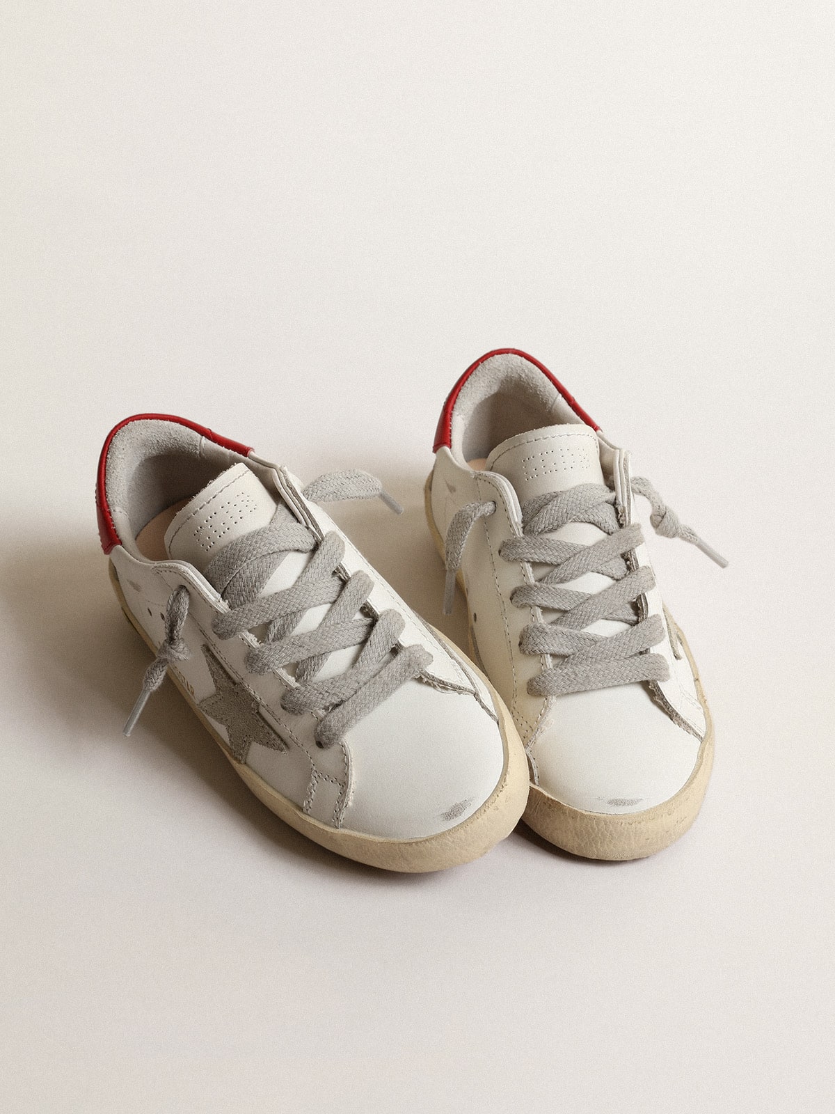 Super-Star Junior with suede star and red leather heel tab| Golden Goose