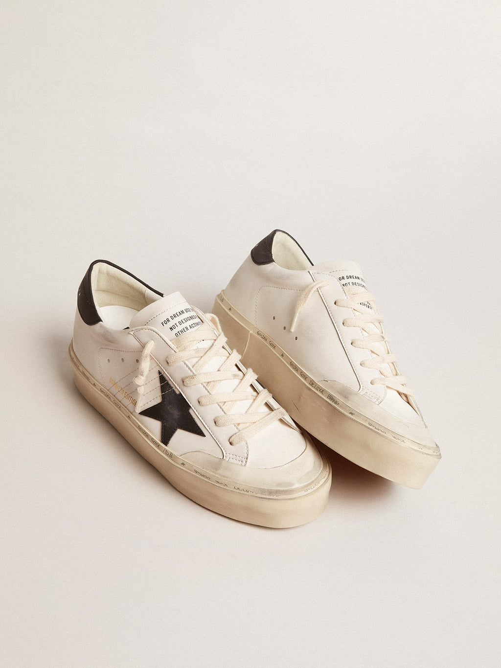 Woman's white bio-based Hi Star LTD with black bio-based star and heel tab| Golden Goose