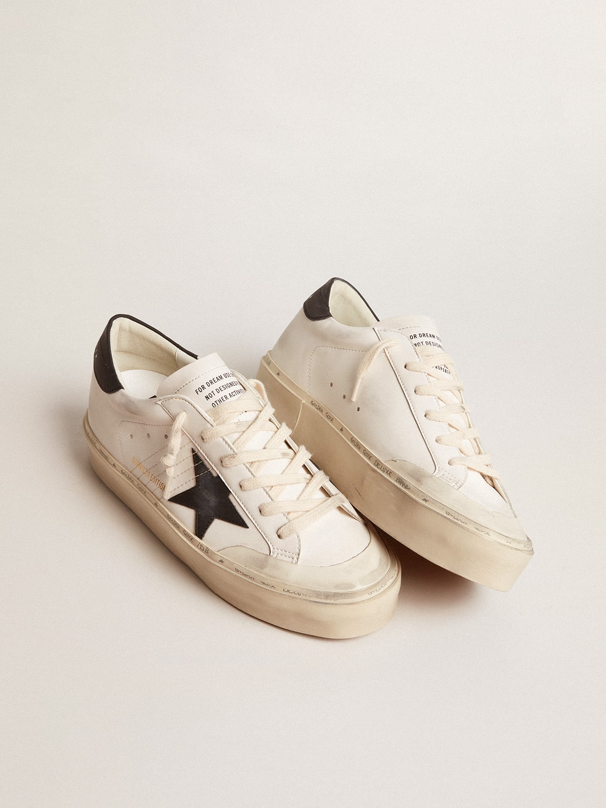 Woman's white bio-based Hi Star LTD with black bio-based star and heel tab| Golden Goose