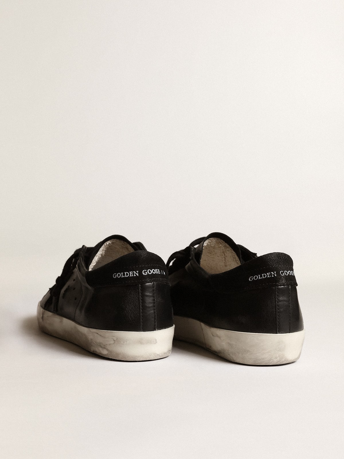 Men's Super-Star in black nappa with black suede star and heel tab| Golden Goose