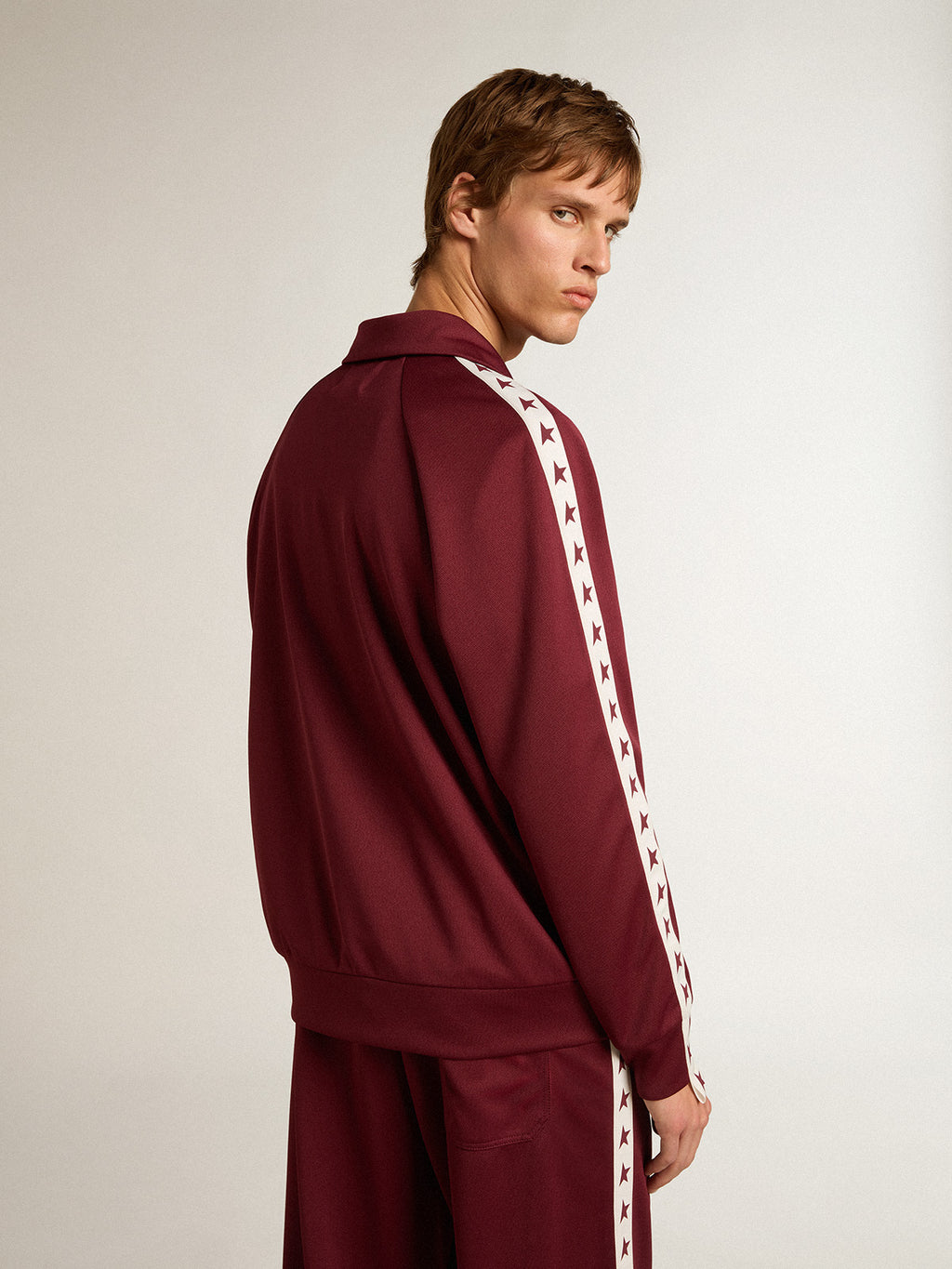 Men's burgundy zipped sweatshirt with white strip and contrasting stars| Golden Goose