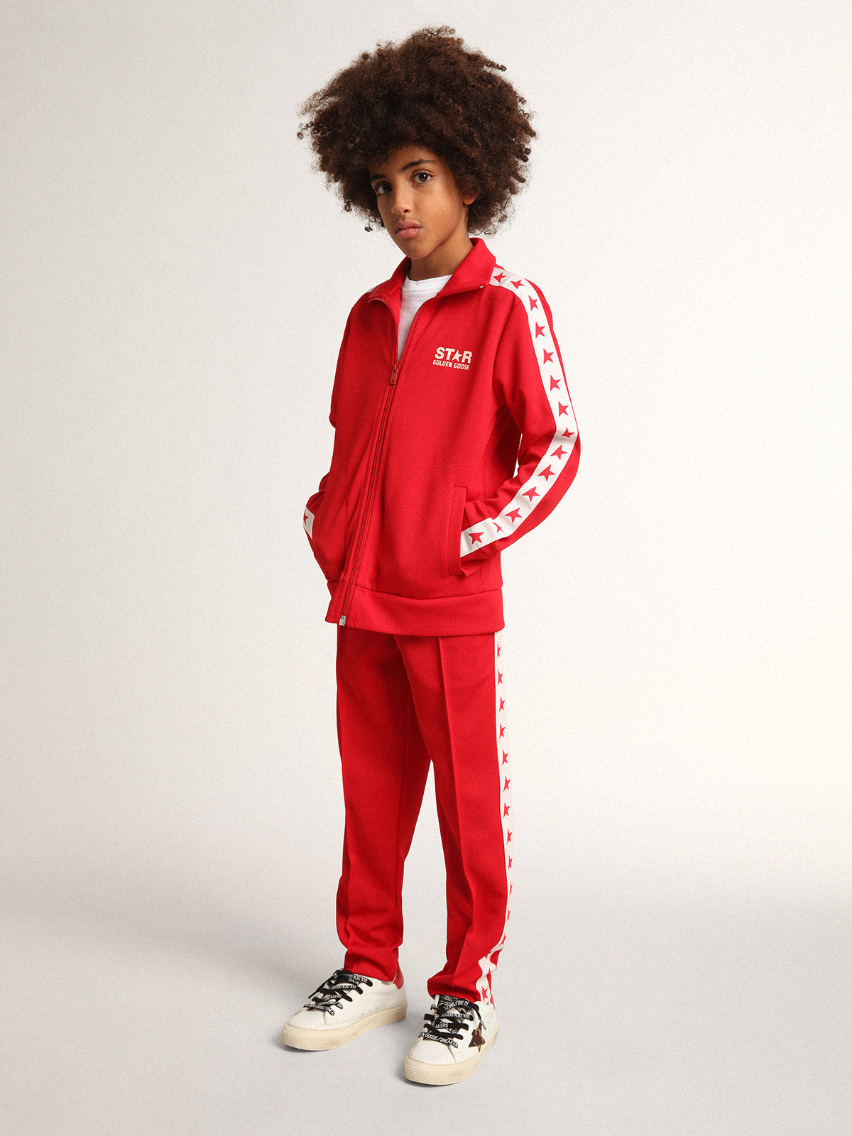 Red joggers with white stripe with contrasting red stars| Golden Goose