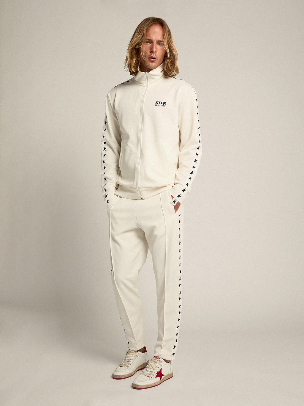 Men's white joggers with black stars on the sides| Golden Goose
