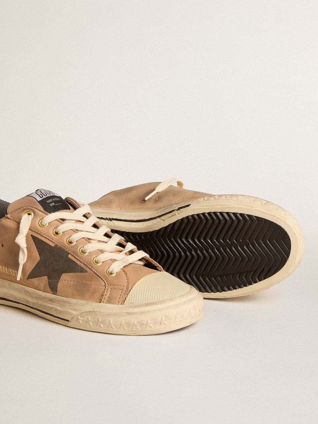 Super-Star in beige nubuck with black printed star and leather heel tab| Golden Goose